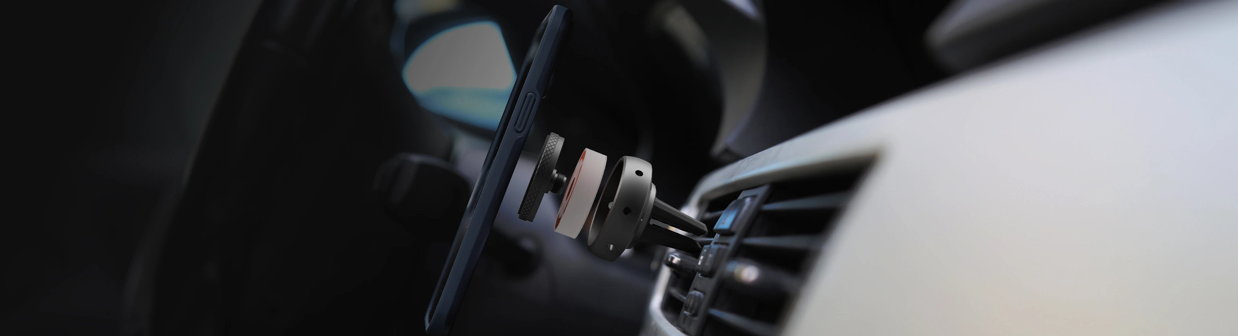 Smartphone secured on Tellur's innovative magnetic car holder with dual functionality as an AI-powered air freshener, providing a seamless blend of technology and comfort for drivers.